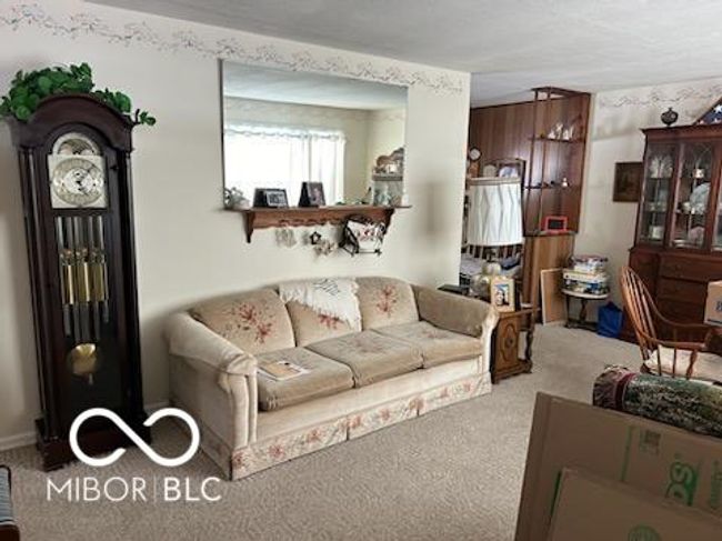living room with carpet flooring | Image 5