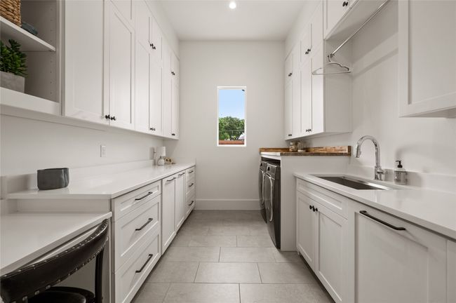 Large Laundry wth Additional Sink and plenty of room for storage and crafting. | Image 18
