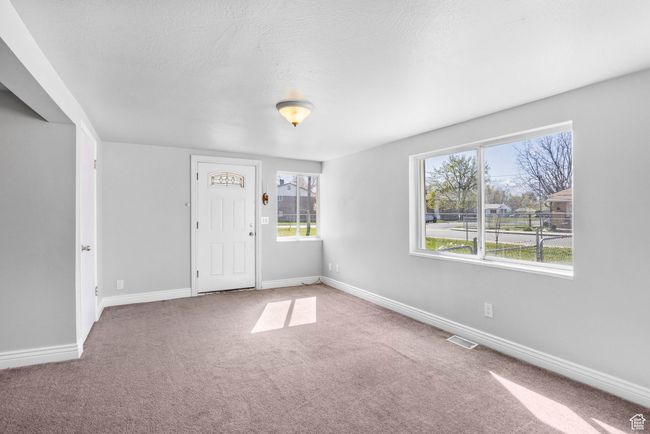 Empty room featuring visible vents, baseboards, and carpet floors | Image 29