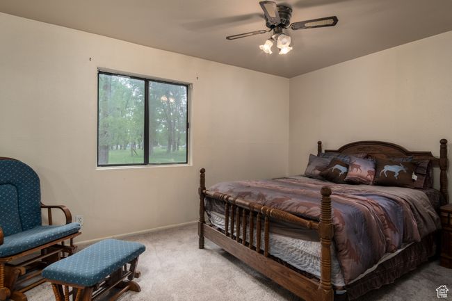 Bedroom featuring carpet floors and ceiling fan | Image 20