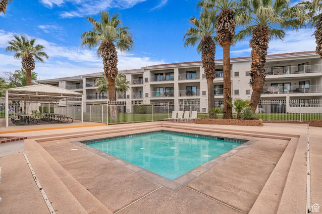 Community pool with a patio area | Image 25