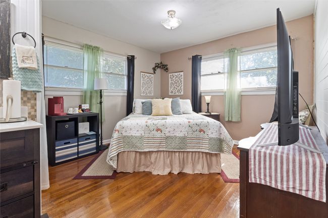 Bedroom with multiple windows and light wood-type flooring | Image 14