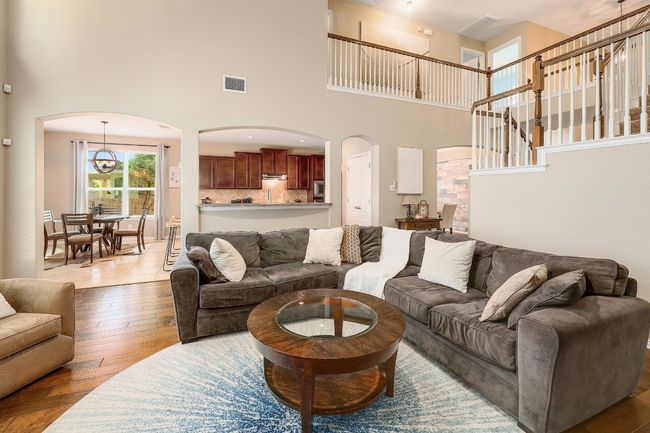 The flow of the living room feels effortless, its open design seamlessly connects the entire space, giving you flexibility to create the perfect setting for everything from casual hangouts to stylish gatherings | Image 14