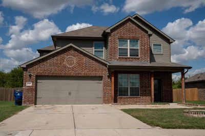 View of front of property with a garage and a front yard | Image 2