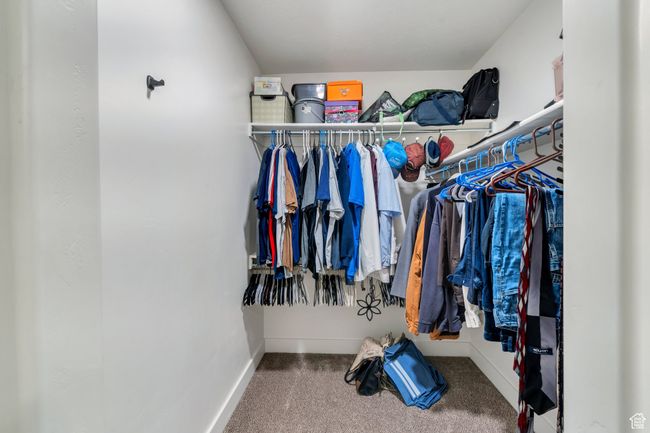 Spacious closet with carpet floors | Image 9