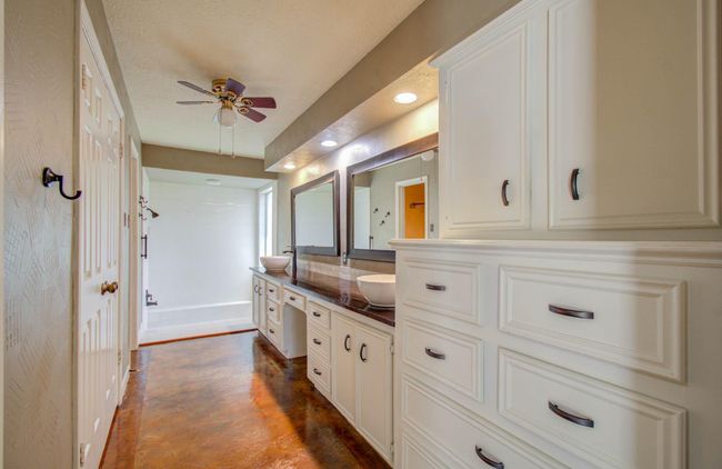 Double sinks with makeup vanity in counter. | Image 25