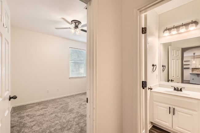 Bathroom featuring vanity and ceiling fan | Image 17