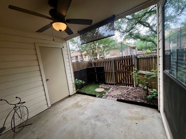 View of patio / terrace with ceiling fan and fence | Image 24