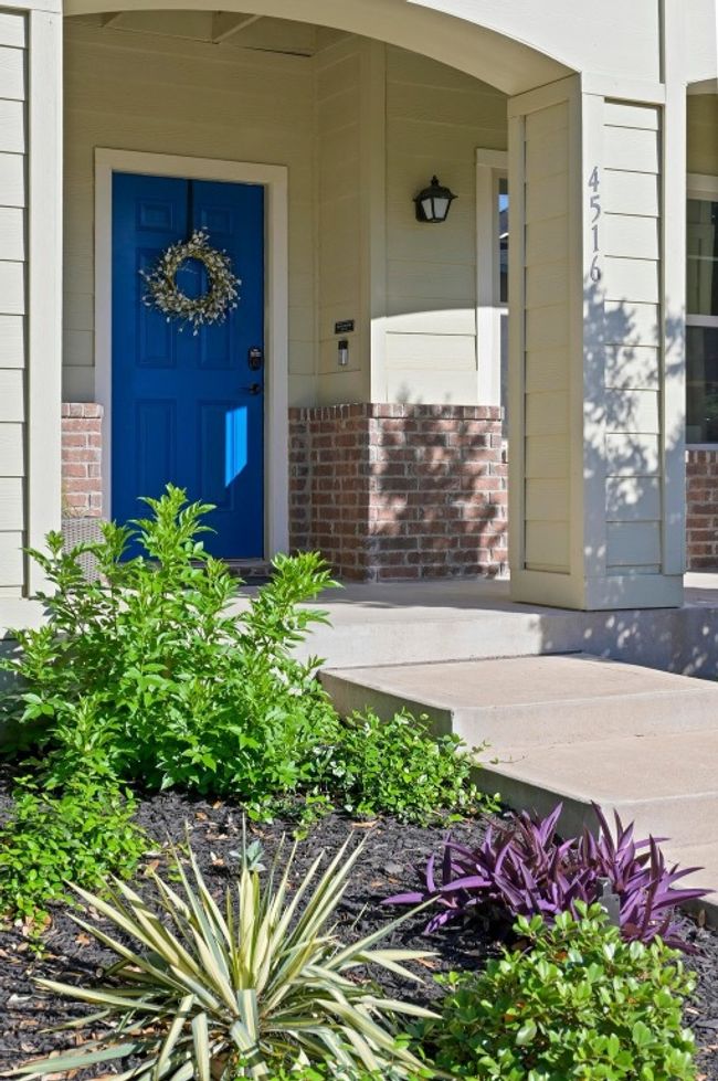 Property entrance with brick siding and a porch | Image 6