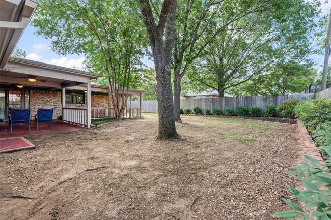 Fenced backyard featuring a wooden deck | Image 27