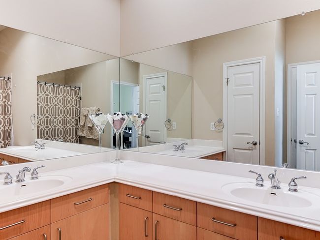 Double vanities. Bath tub and shower. | Image 12
