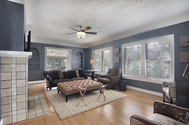 Living room with plenty of natural light, a textured ceiling, and ceiling fan | Image 22