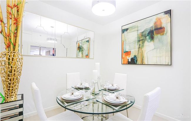 Dining space with light tile patterned flooring | Image 14