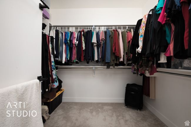 Spacious closet with carpet floors | Image 24