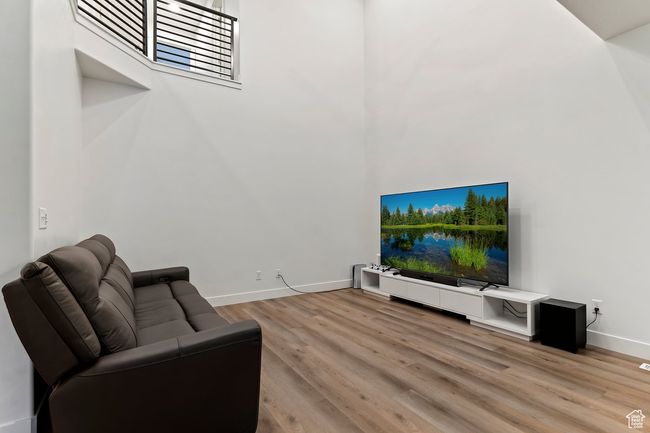 Living room with light hardwood / wood-style flooring | Image 7