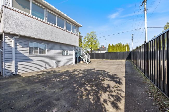 View of home's exterior with fence and stairs | Image 36
