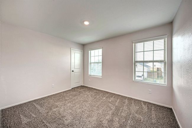 Carpeted empty room with baseboards | Image 27