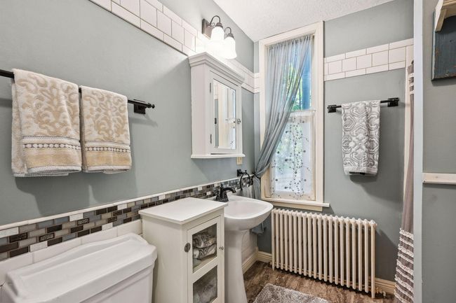 Here is an up-close look at the 3/4 bath on the main level just past the dining room connected to the kitchen. | Image 31