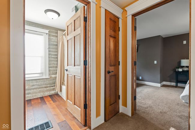 hallway featuring carpet floors and wood finished floors | Image 30