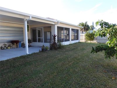 Porch across the entire back of home! | Image 2