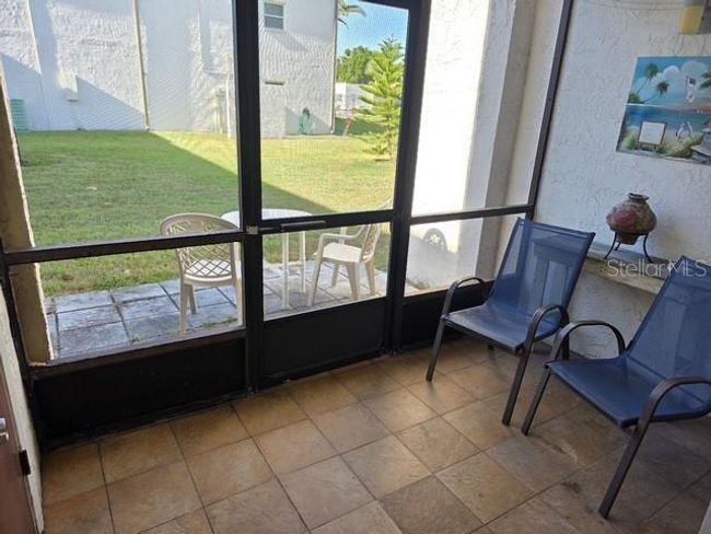 Screened in area and outside patio | Image 13