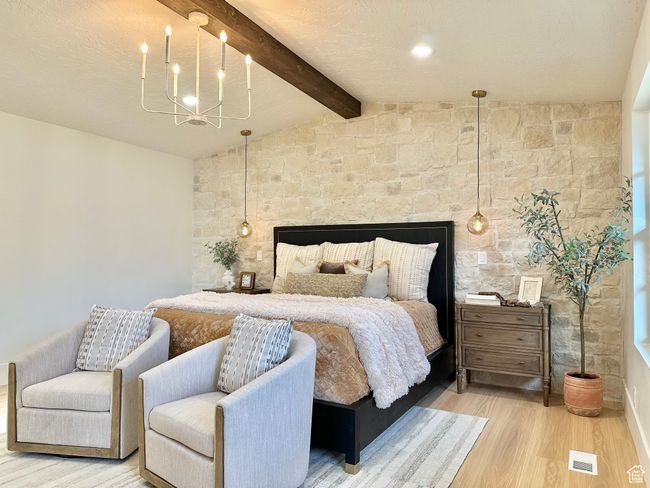 Bedroom featuring light wood finished floors and a chandelier | Image 20