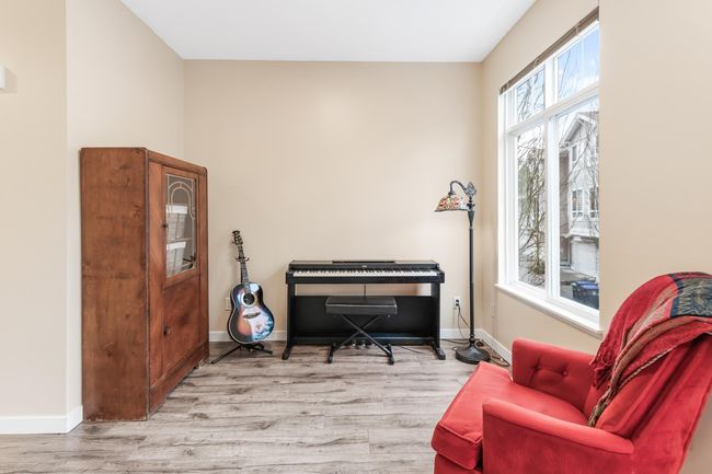 Living area featuring baseboards and wood finished floors | Image 17