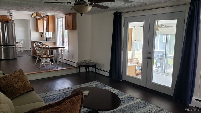 New french doors lead to the 3 season room | Image 11