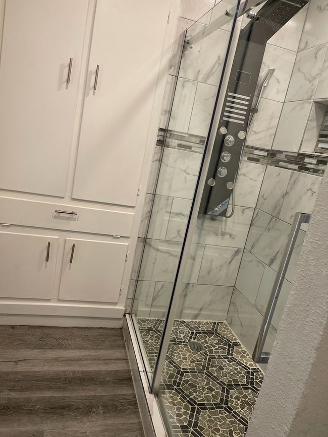 Bathroom featuring an enclosed shower and hardwood / wood-style floors | Image 15