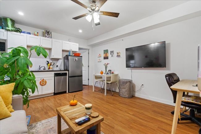 The open floor plan allows for easy mobility, making it easy to maneuver between spaces in the home. | Image 6