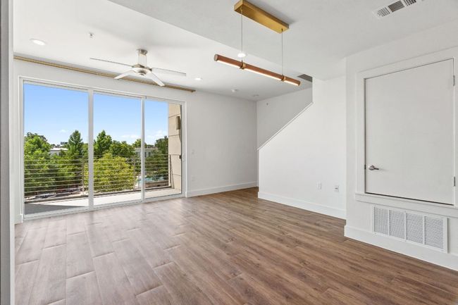 High ceilings throughout, abundant natural light, and a modern design define this home. | Image 12