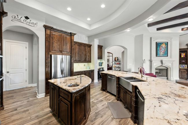 The kitchen sink has a foot pedal that gives you reliable hands free faucet access. | Image 17