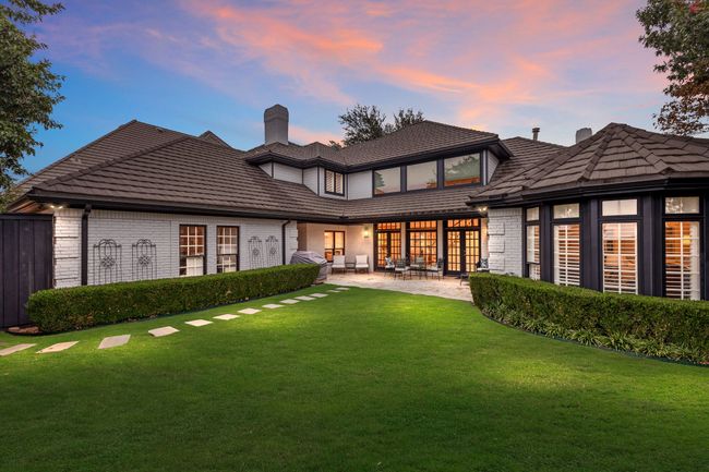 Mature landscaping at back of home with large yard | Image 34