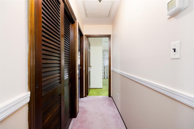 Corridor with visible vents and carpet | Image 22