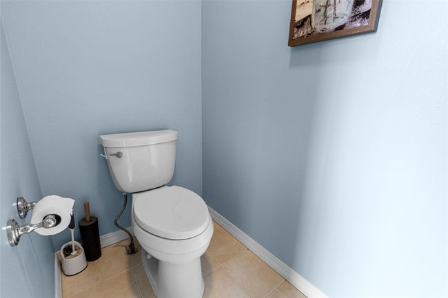 Bathroom with toilet and tile patterned floors | Image 48