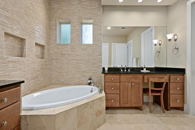 Bathroom featuring vanity, a bath, and recessed lighting | Image 14