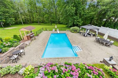 View of swimming pool with a gazebo, a lawn, and a patio | Image 3