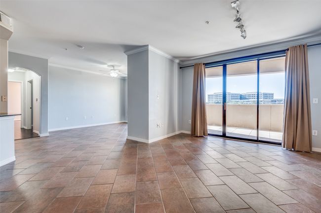 Living room with adjacent study provides ample room in this open-concept floor plan | Image 28