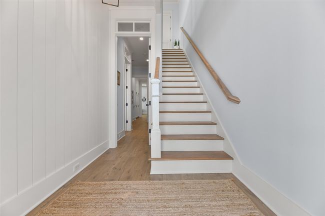 Lower-level entry foyer featuring a shiplap accent wall. | Image 23
