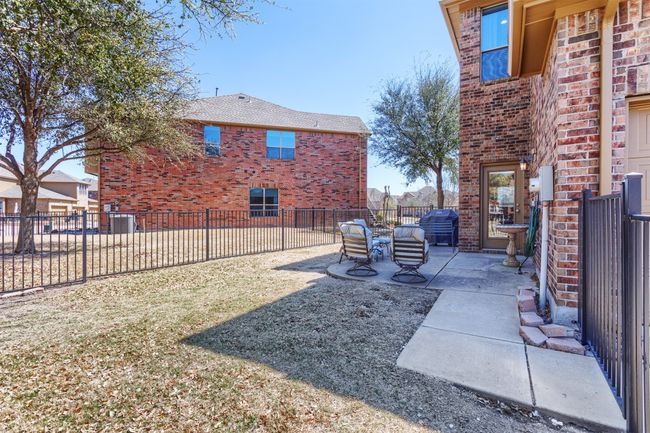 View of yard with a patio and fence | Image 33