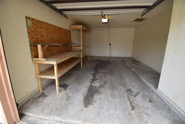 Garage with a garage door opener | Image 14