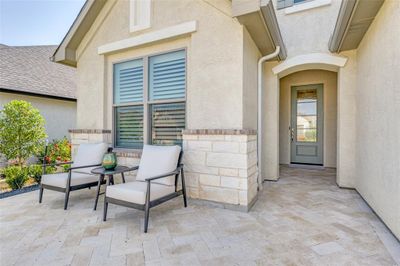 Travertine pavers in herringbone pattern provide an elegant enlarged outdoor living space. | Image 3