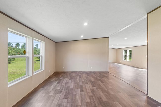 Unfurnished room featuring wood finished floors and recessed lighting | Image 31