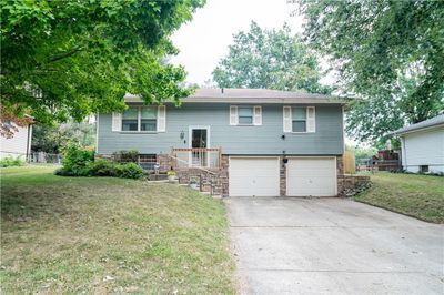 Raised ranch with a front lawn and a garage | Image 3