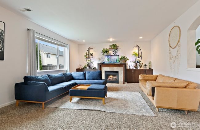 Light-filled great room with seamless flow to dining and kitchen spaces. | Image 10