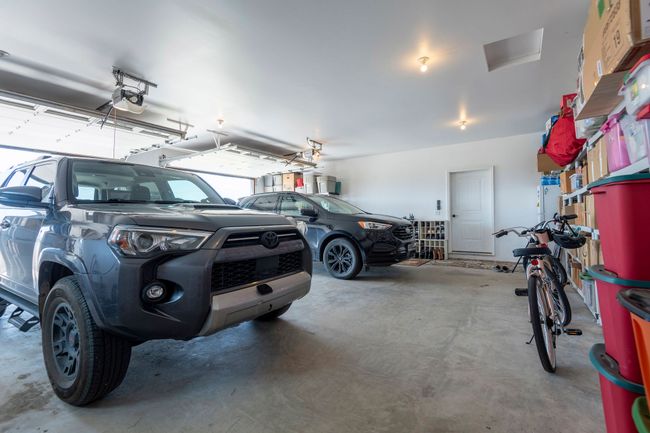 Garage with a garage door opener | Image 26