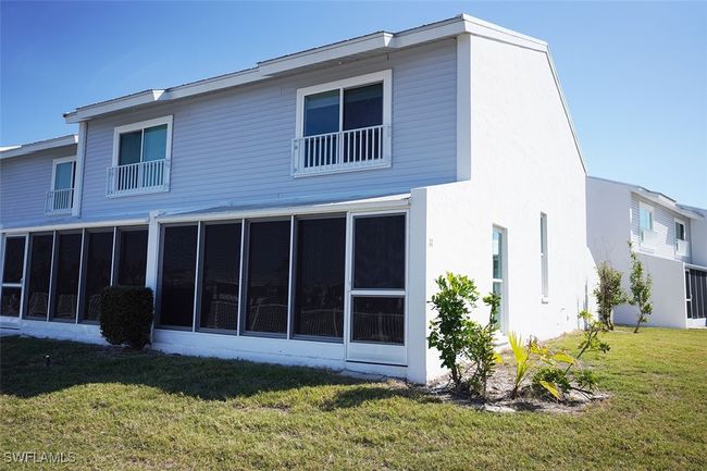 Rear view sunroom, and stucco siding | Image 5