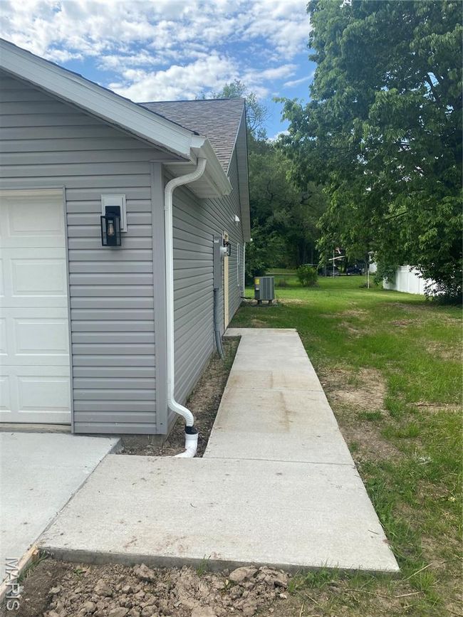 24x20 2 Car Garage with a garage door opener and baseboards | Image 28