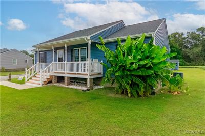 View of front of property featuring a porch and a front lawn | Image 2