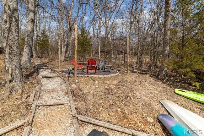 View of yard featuring an outdoor fire pit | Image 70